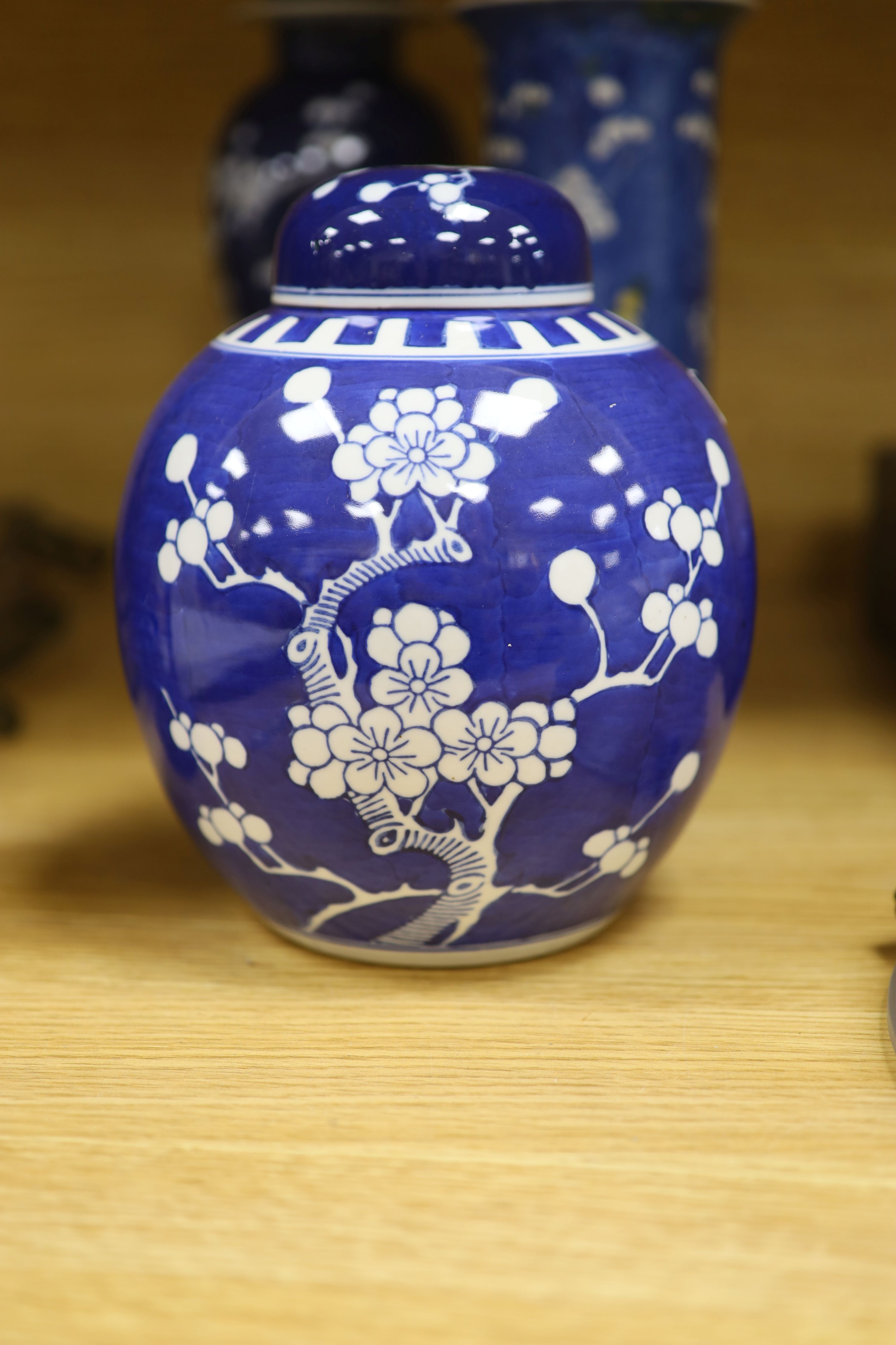 A Chinese blue and white cylindrical vase, another vase and cover and a blue and white jar and cover, together with a cloisonne vase and a bronze censer, tallest 32cm